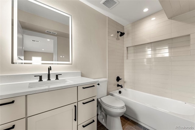 full bath with visible vents, vanity, toilet, and shower / bathing tub combination