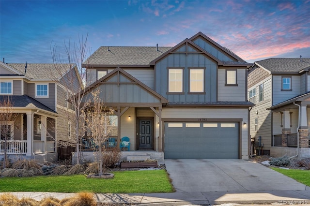 craftsman inspired home featuring a garage and covered porch