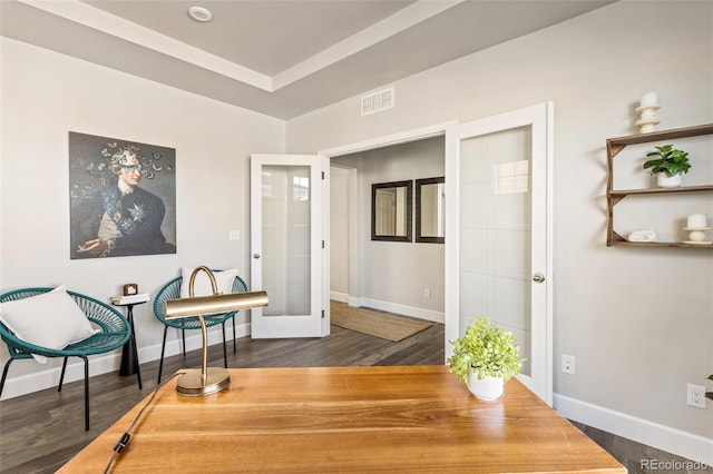 sitting room with dark wood-type flooring and french doors