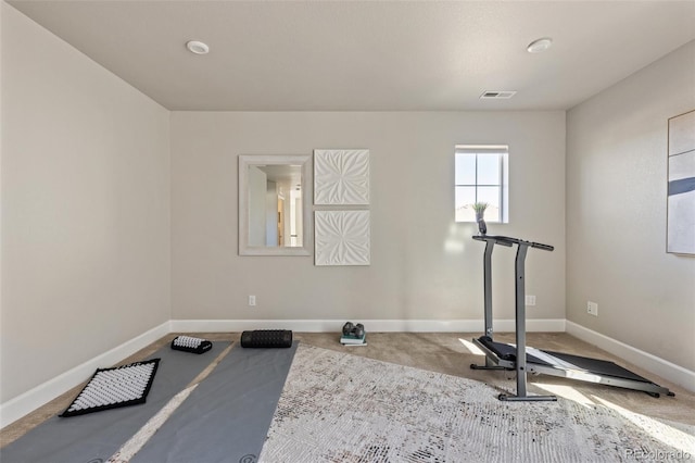 exercise area featuring carpet flooring