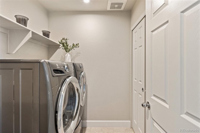 laundry room with separate washer and dryer