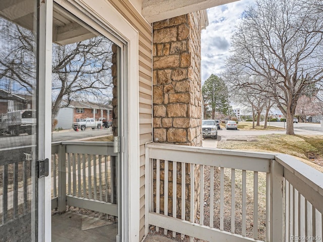 balcony with a residential view and covered porch