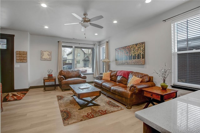 1111 E St, Salida, CO 81201 - living room featuring plenty of natural light, a ceiling fan, recessed lighting, and light wood-style flooring