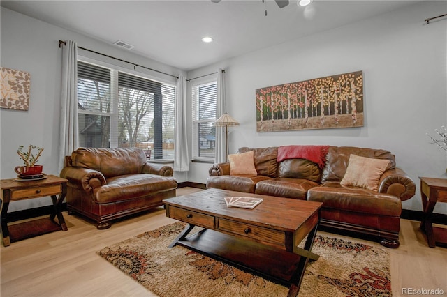 1111 E St, Salida, CO 81201 - living area with wood finished floors, healthy amount of natural light, recessed lighting, and ceiling fan