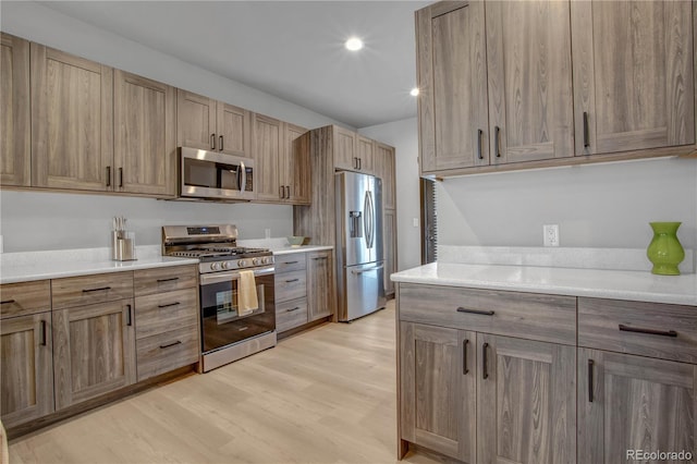 1111 E St, Salida, CO 81201 - kitchen featuring appliances with stainless steel finishes and light wood finished floors