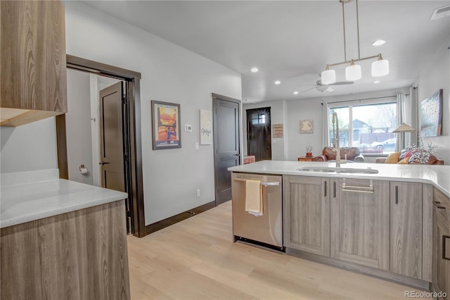 1111 E St, Salida, CO 81201 - kitchen with dishwasher, light countertops, light wood-style flooring, recessed lighting, and modern cabinets
