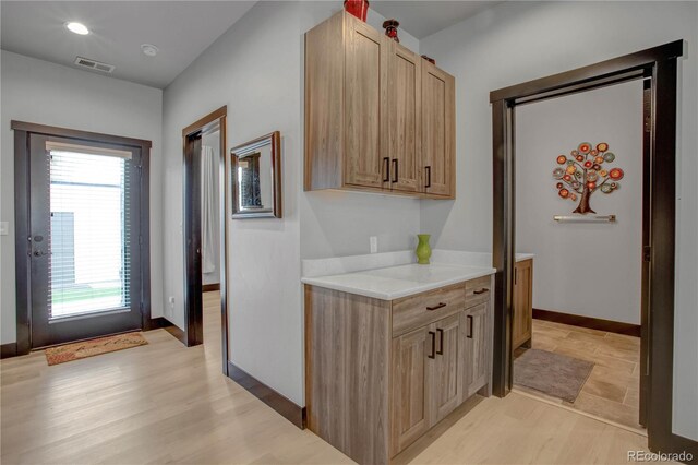 1111 E St, Salida, CO 81201 - kitchen with light brown cabinetry, light countertops, and light wood-style flooring