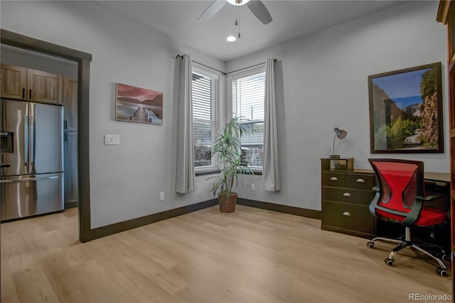 1111 E St, Salida, CO 81201 - home office featuring light wood-style flooring and ceiling fan