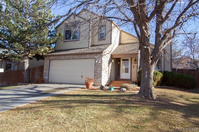 view of front of house with a front lawn and a garage