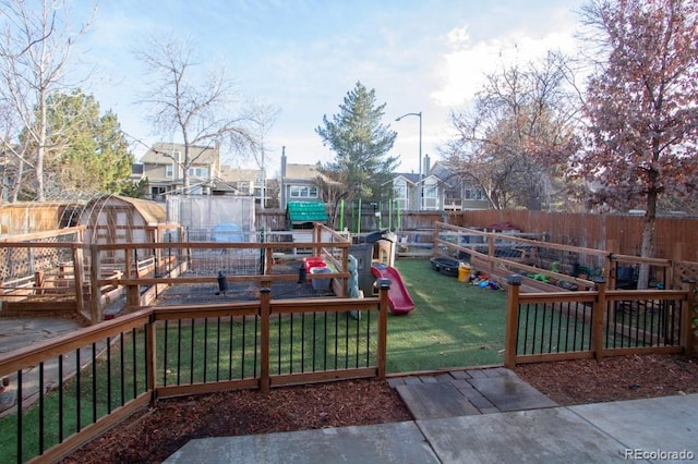 view of playground with a yard