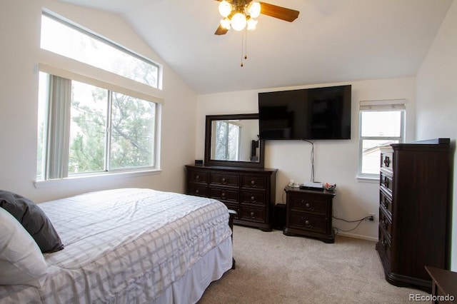 bedroom with lofted ceiling, light carpet, ceiling fan, and multiple windows