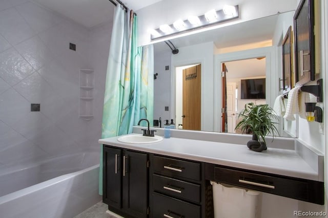 bathroom featuring shower / tub combo and vanity