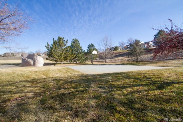 view of yard with community basketball court