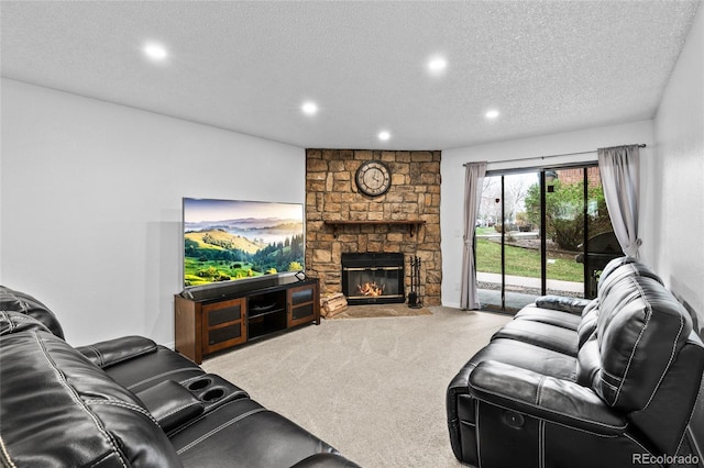 carpeted living room featuring recessed lighting, a fireplace, and a textured ceiling