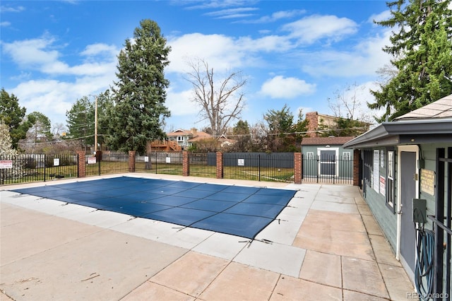 pool with fence and a patio area