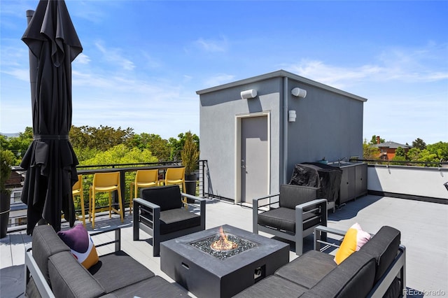 4950 Lowell Blvd, Denver, CO 80221 - view of patio with an outdoor living space with a fire pit, area for grilling, and a deck