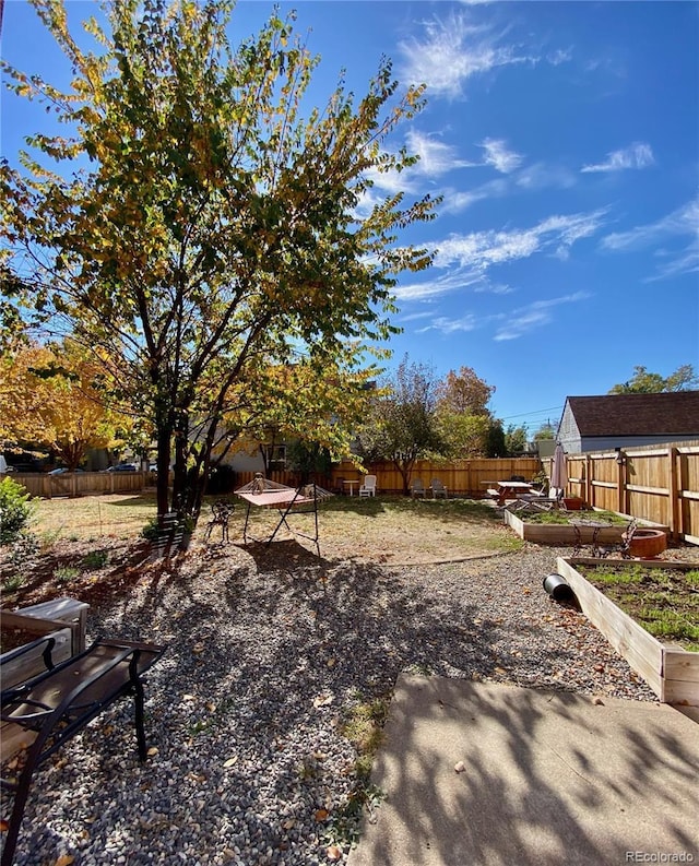 85 N Grant St Unit 22, Denver, CO 80203 - fenced backyard featuring a vegetable garden