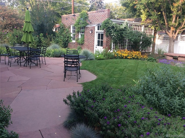 view of yard with a patio and fence