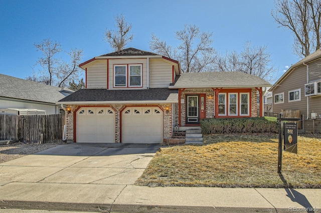 split level home featuring brick siding, a shingled roof, fence, driveway, and an attached garage