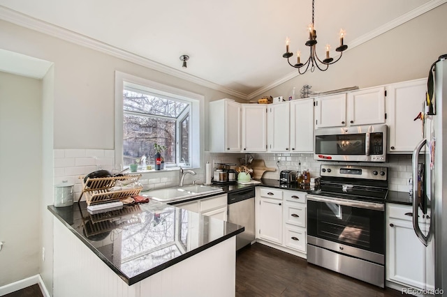 kitchen featuring a sink, dark countertops, and stainless steel appliances