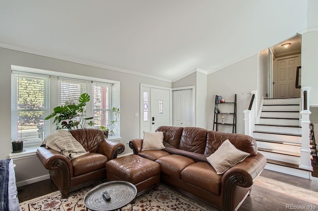 living area with stairs, lofted ceiling, wood finished floors, and ornamental molding