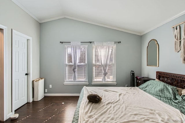 bedroom with baseboards, lofted ceiling, dark wood-type flooring, and crown molding