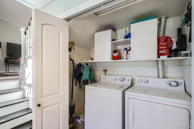 clothes washing area with washer and clothes dryer and laundry area