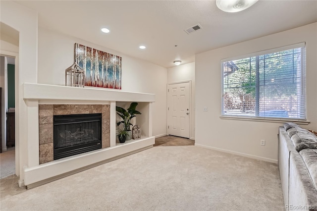 803 E 98th Ave Unit 105, Thornton, CO 80229 - unfurnished living room featuring carpet flooring, a fireplace, baseboards, and recessed lighting
