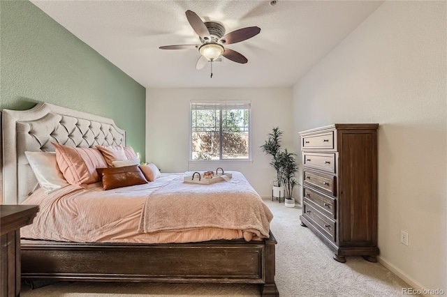 803 E 98th Ave Unit 105, Thornton, CO 80229 - bedroom with light carpet, baseboards, and ceiling fan