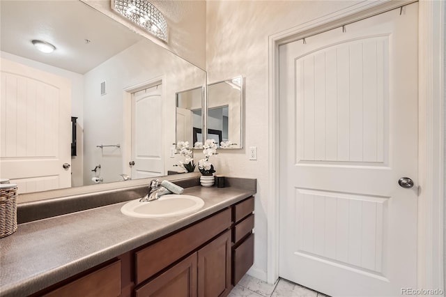 803 E 98th Ave Unit 105, Thornton, CO 80229 - bathroom featuring vanity and marble finish floors