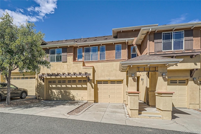 803 E 98th Ave Unit 105, Thornton, CO 80229 - multi unit property featuring stucco siding, an attached garage, and driveway