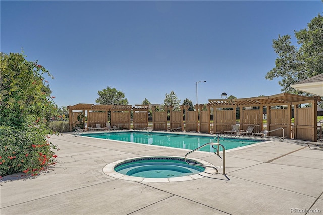 803 E 98th Ave Unit 105, Thornton, CO 80229 - community pool with a community hot tub, a pergola, fence, and a patio