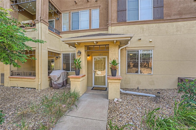 803 E 98th Ave Unit 105, Thornton, CO 80229 - property entrance featuring a balcony and stucco siding