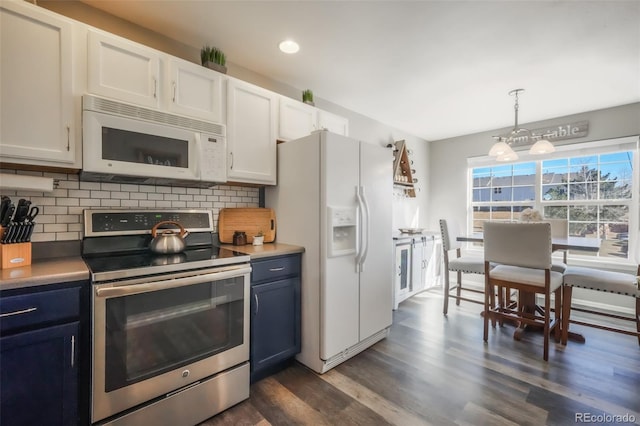 kitchen with white appliances, blue cabinets, dark wood-style floors, and tasteful backsplash