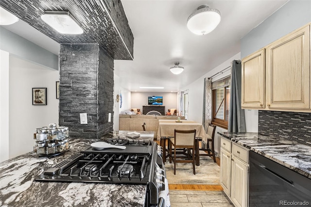 kitchen featuring backsplash, dishwasher, open floor plan, stone counters, and light brown cabinets