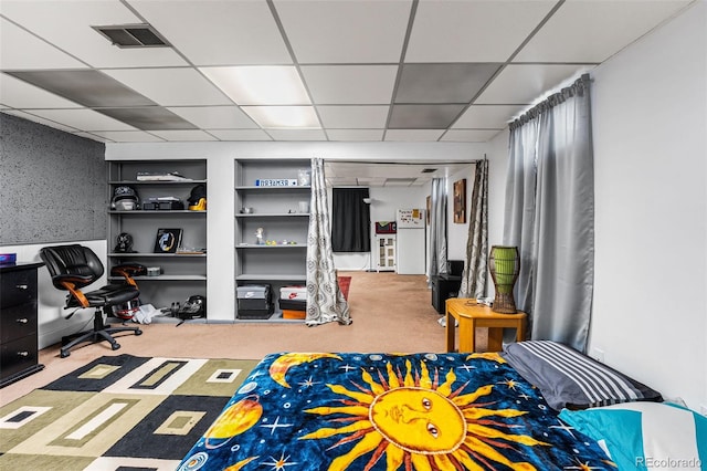3191 S Holly Pl, Denver, CO 80222 - basement with a paneled ceiling, carpet, and built in features