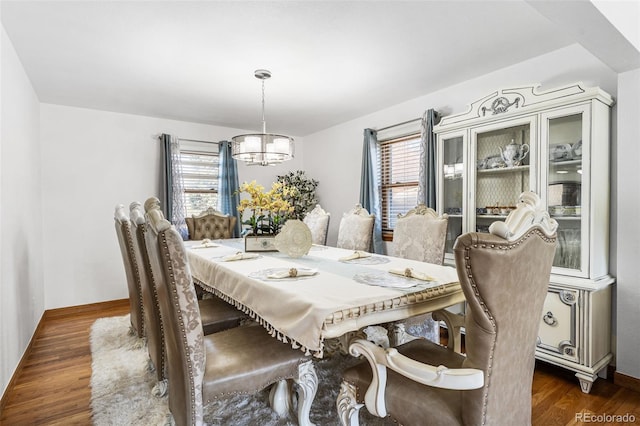 3191 S Holly Pl, Denver, CO 80222 - dining room with a chandelier, dark wood-style floors, and baseboards