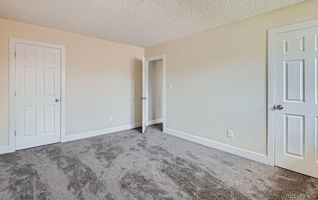 8039 Wolff St Unit E, Westminster, CO 80031 - unfurnished bedroom with carpet floors, a textured ceiling, and baseboards