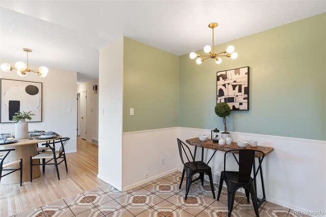 1411 Acacia Dr, Colorado Springs, CO 80907 - dining room with a chandelier