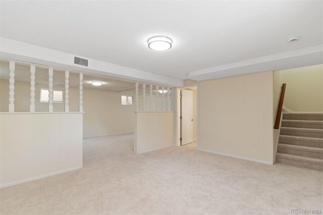 1411 Acacia Dr, Colorado Springs, CO 80907 - basement featuring carpet floors and stairs