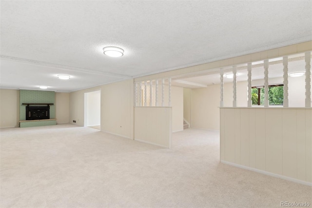 1411 Acacia Dr, Colorado Springs, CO 80907 - below grade area featuring a textured ceiling, a fireplace, carpet flooring, and stairs