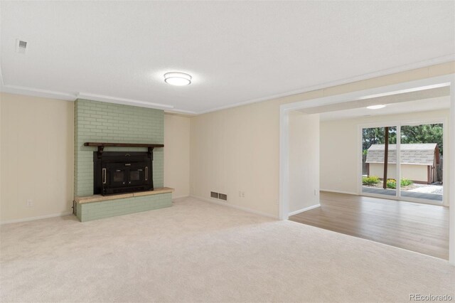 1411 Acacia Dr, Colorado Springs, CO 80907 - unfurnished living room featuring carpet flooring and a brick fireplace