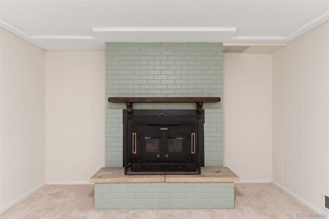 1411 Acacia Dr, Colorado Springs, CO 80907 - detailed view of carpet flooring, a textured ceiling, and a brick fireplace