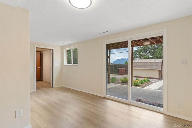 1411 Acacia Dr, Colorado Springs, CO 80907 - empty room with wood finished floors and baseboards