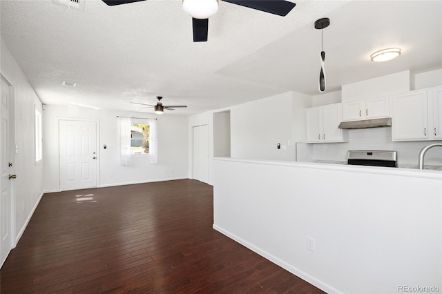 1455 W Alaska Pl, Denver, CO 80223 - unfurnished living room featuring ceiling fan, a textured ceiling, and dark wood-style floors
