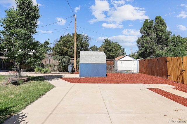 1455 W Alaska Pl, Denver, CO 80223 - fenced backyard with a storage shed and a patio area