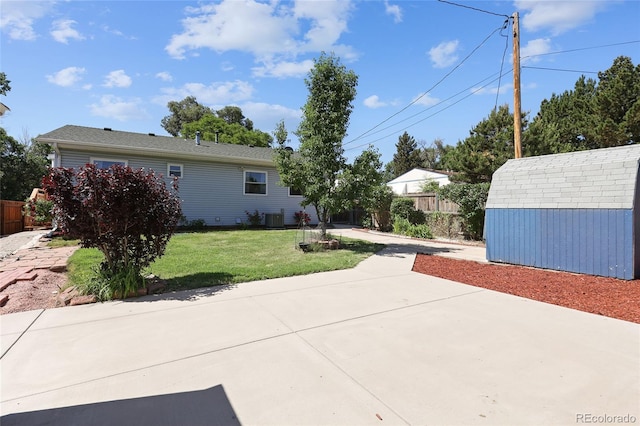 1455 W Alaska Pl, Denver, CO 80223 - view of property exterior featuring a storage shed and a patio area
