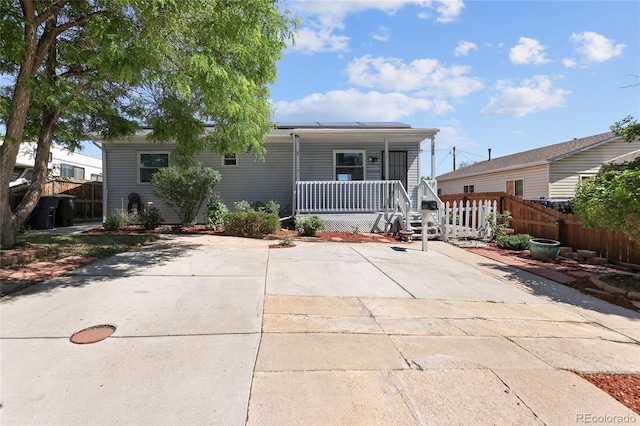1455 W Alaska Pl, Denver, CO 80223 - back of property with a porch