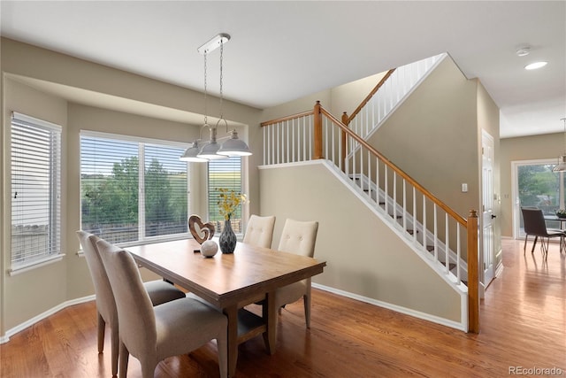 3232 Cimarron Pl, Superior, CO 80027 - dining room with wood finished floors, stairway, a chandelier, and recessed lighting