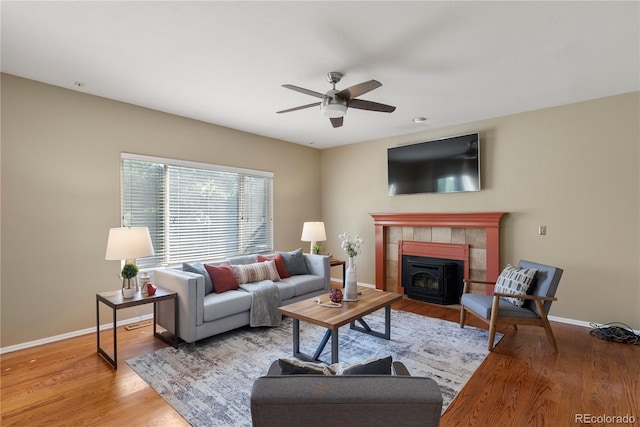 3232 Cimarron Pl, Superior, CO 80027 - living area with ceiling fan, wood finished floors, and a tiled fireplace